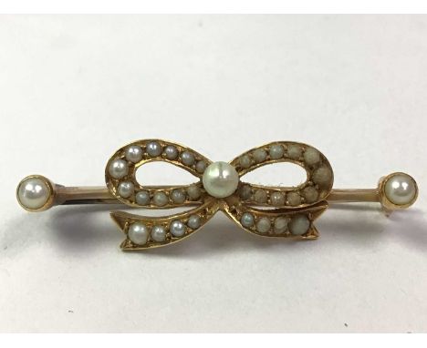 SEED PEARL BOW BAR BROOCH, AND A SAPPHIRE CLUSTER RING the brooch unmarked, the ring in silverQty: 2