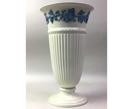 GROUP OF WEDGWOOD AND SPODE VASES, each in monochrome white, the taller Wedgwood vase with a border of blue blue footing vine