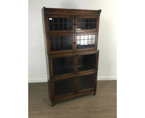 MINTY OAK STACKING SECTIONAL BOOKCASE, EARLY 20TH CENTURY  with glazed doors157cm high, 90cm wideDamage present to panel of g