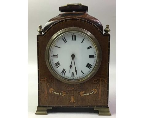 EDWARDIAN MAHOGANY MANTEL CLOCK, EARLY 20TH CENTURY inlaid with floral fastoons beneath a white enamel dial and with brass ha