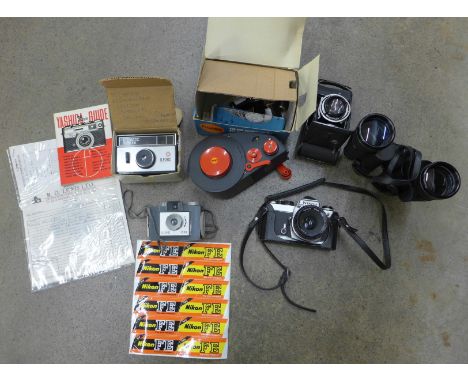 A Nikon 35mm SLR film camera, a pair of Revue 16 x 50 binoculars, three other cameras and booklets 