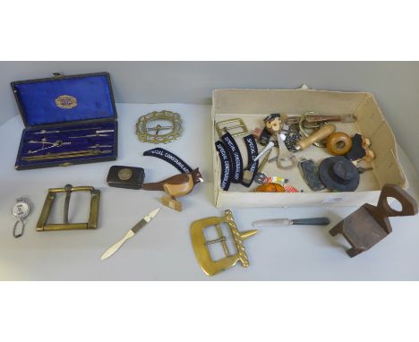 A papier-mache snuff box, drawing instruments, brass buckles, amber and insect pendant and treen 