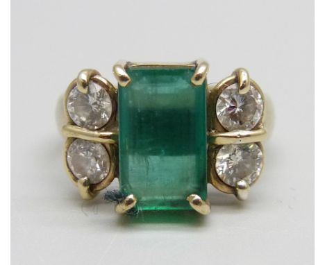 An 18ct gold, emerald and diamond ring, 7.1g, M, emerald 7mm x 11mm 