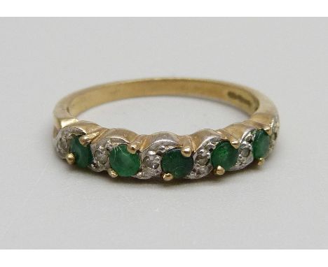 A 9ct gold, diamond and emerald ring, 1.9g, N 