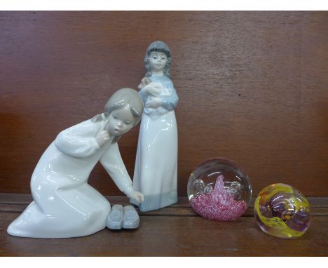 A Nao figure and one Lladro, a Caithness glass paperweight and one other 