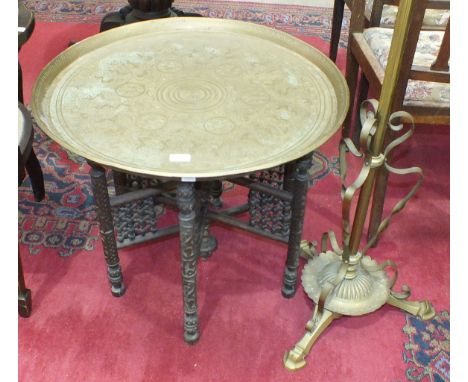 A brass adjustable lamp standard converted to electricity and a brass Benares tray with folding wooden stand, (2).