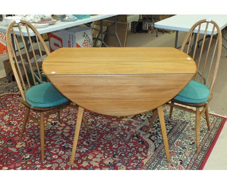 An Ercol light wood drop-leaf table, 122 x 112cm open and a pair of hoop stick-back chairs, (3).