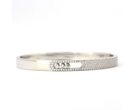 A 925 silver happy diamonds style bangle set with round cut cubic zirconias, 6.5 x 5.8cm.