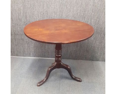 A Georgian mahogany tripod leg, tilt top tea table, H. 70cm Dia. 79cm.