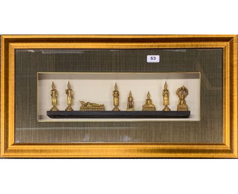 A cased set of Thai Buddhist figures, frame size 74 x 39cm.