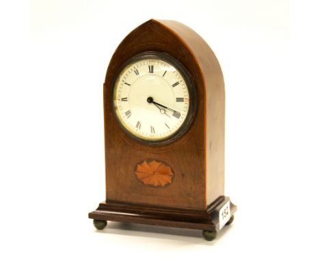 An Edwardian inlaid mahogany arched mantel clock, H. 22cm.