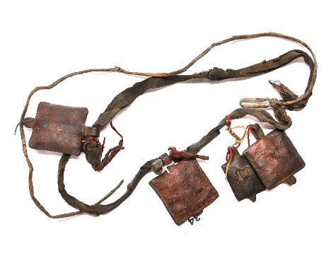A Tibetan Nomad's leather sash with pouches containing prayers originally from Gyantse, Tibet. Prov. Estate of the late Dr. J
