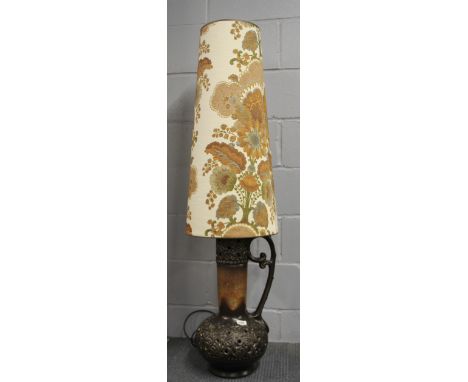 A 1970's German pottery floor lamp with original shade, H. 137cm.