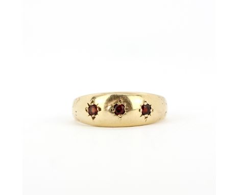 A hallmarked 9ct yellow gold ruby set ring, (N).