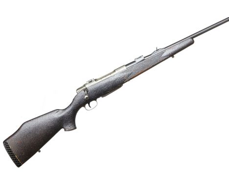 A 6.5 x 68mm Sauer Model 80 bolt action rifle. Serial No.E21147. Std. Specs. Walnut stock with cheekpiece. All covered in cra