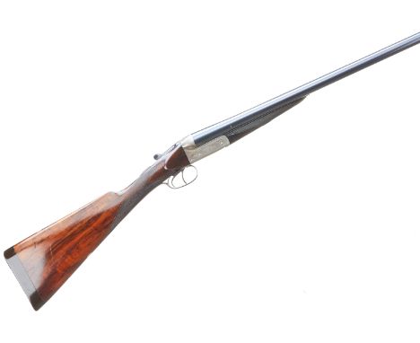 Ribbed Vulcanite 1" extension to butt. Pleasantly figured stock with chequered straight grip and forend. Plain rib with cross