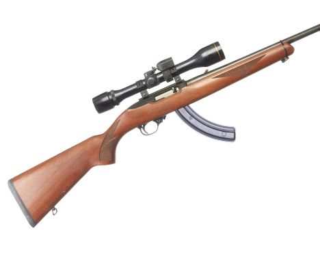 A .22lr Ruger Model 10/22 Carbine. Serial No.247-94738. Std. Specs. Fitted extended rotary magazine, moderator and ASI 4 x 40