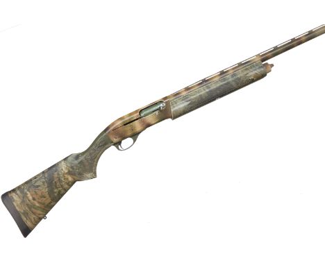 A 12 bore Remington Model 1100 self loading shotgun. Serial No.L687678V. Std. Specs. Magazine Restricted . 'Camo' stock and a