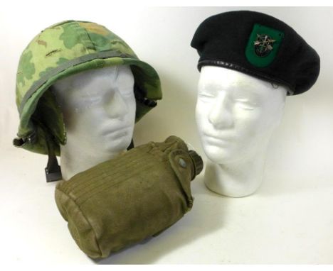 United States of America Army/Marines helmet and cover, circa Vietnam era

The painted metal helmet with camouflage cover, Un