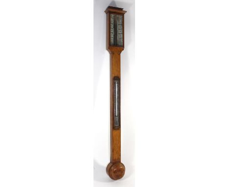 A Victorian oak stick barometer

The ivory angled scales signed J. B. Dancer Optician, Manchester, the trunk with mercury tub