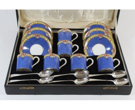 A cased set of six Royal Worcester coffee cans and saucers

Pattern no. 994, together with six accompanying Sheffield hallmar