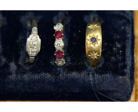 A 9ct gold five stone diamond and ruby ring; together with a three stone diamond ring; and a sapphire and diamond gypsy set r