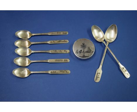 A set of five Arabic niello coffee spoons; together with two matching teaspoons; and a similar circular compact, 5.1cm diamet