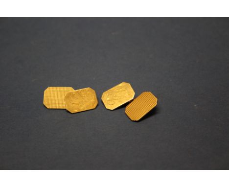 A pair of 9ct gold engine turned cufflinks, of chamfered rectangular form, 7.7g.