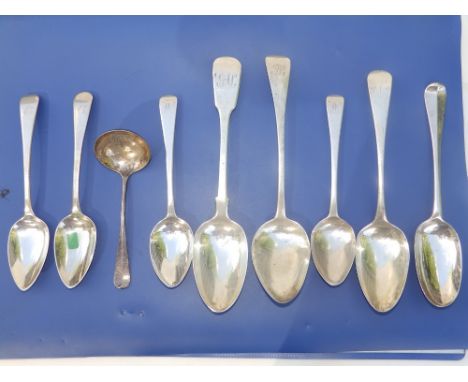 An 18thC English silver crested spoon with rat-tail bowl, seven other silver spoons and a sauce ladle. (9)