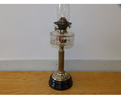 A Victorian brass column oil lamp with cut glass font, 18" - no shade.