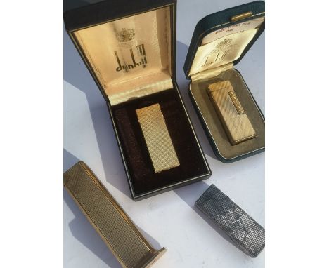 A Dunhill Tallboy lighter and three other Dunhill lighters. (4)