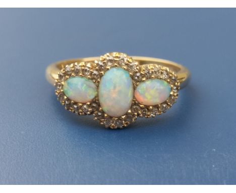 An Edwardian three stone opal &amp; diamond 18ct gold cluster style ring - Birmingham marks for 1902.  Finger size P.