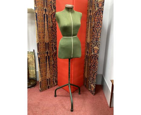 Singer Mannequin Circa Mid XX Century, with green fabric torso on tubular metal support and tripod base.