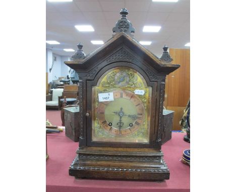 Late XIX century Oak Cased Mantel Clock, a triangular pediment with finials, arched door, brass dial, with Roman numerals, pl