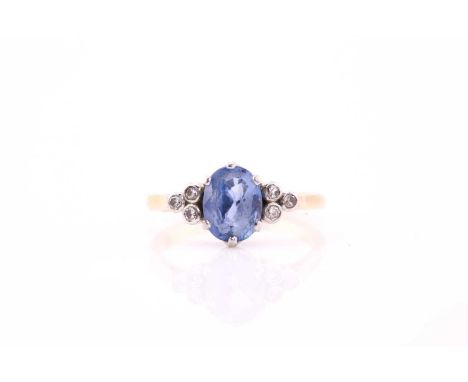 A sapphire and diamond ring, consisting of an oval light blue sapphire, approximately measuring 7.4 x 5.9 mm claw set on a wh