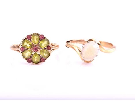 A single stone opal ring, the claw mounted oval opal in 18 carat gold crossover mount; Ring size N, with sizing band; togethe