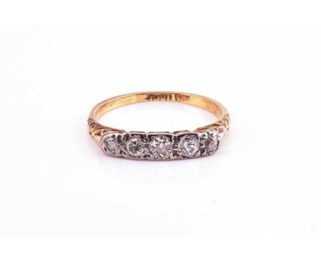 A diamond half hoop ring, the five graduated old cut diamonds set in yellow metal stamped 18ct, ring size O, 2.7grams gross.