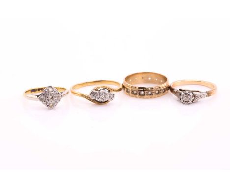 A collection of four diamond set rings, consisting of a flush set band size K; a diamond cluster ring, size J½; a three stone