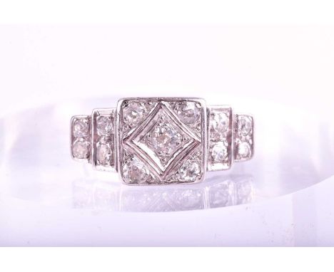 An Art Deco style tiered diamond cluster ring; the central square cluster set with five pavé set old brilliant cut diamonds a