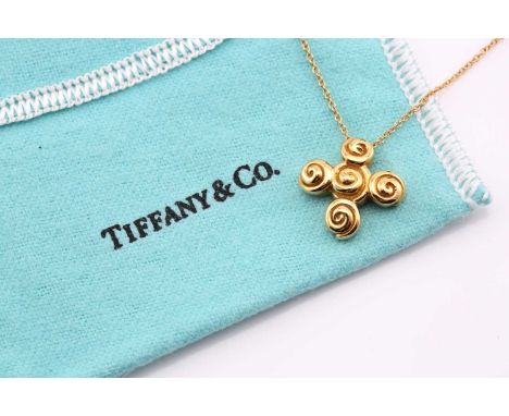 A Tiffany and Co 18ct yellow gold spiro swirl rosebud pendant with a trace link chain measuring 40cm in length and a total it