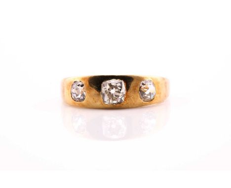 A Victorian three stone diamond ring, consisting of three sunk set old European cut diamonds with an estimated weight of 1.00
