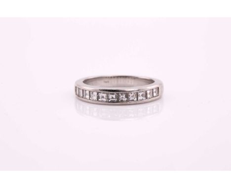 A Tiffany &amp; Co. platinum half eternity ring, consisting of eleven square step-cut diamonds estimated total weight 0.22cts