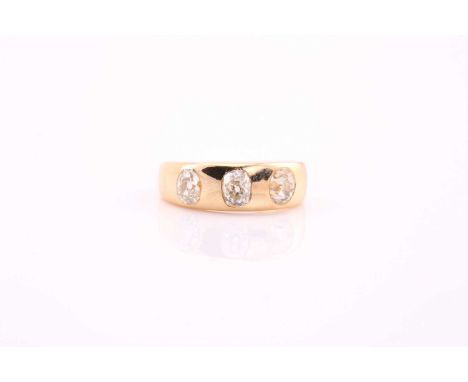 An old cut diamond set three stone gypsy ring, sunk set with oval old cut diamonds with the central stone measuring approxima