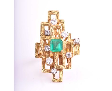 A modernist emerald and diamond dress ring, consisting of a centre square emerald approximately measuring 5.7 mm, along with 