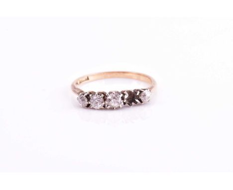 A four diamond ring, each round brilliant cut diamond claw set to a yellow mount, stamped ‘18ct’, ring size K, 1.4 grams (one