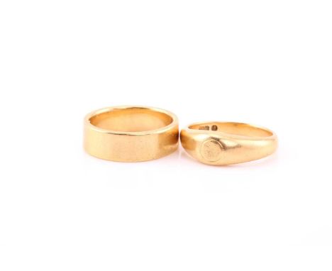 An 18 carat gold wedding band; wide, angled band 7mm depth. Ring size Q, 9.82 grams; together with an 18 carat gold ring, wit