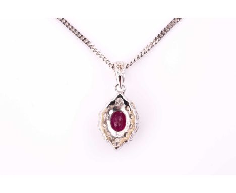 An 18ct white gold ruby and diamond cluster pendant on chain, consisting of an oval ruby approximately measuring 5.3 x 3.8 mm