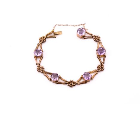 An Edwardian 9ct gold amethyst bracelet, consisting of five hexagon step-cut amethysts, approximately sized 9.9 mm, tube set 