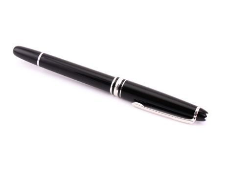 A Montblanc Meisterstuck Pix Classique ballpoint pen, measuring 167mm in length with a pull draw cap and blue ink, topped wit