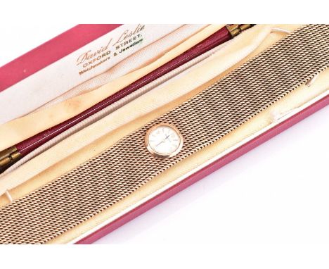 A lady's 9ct yellow gold Jaeger Le Coultre wristwatch with a quartz Swiss-made movement in a 9ct yellow gold round case measu